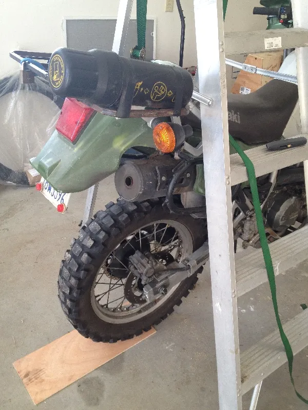 motorcycle raised with ladder
